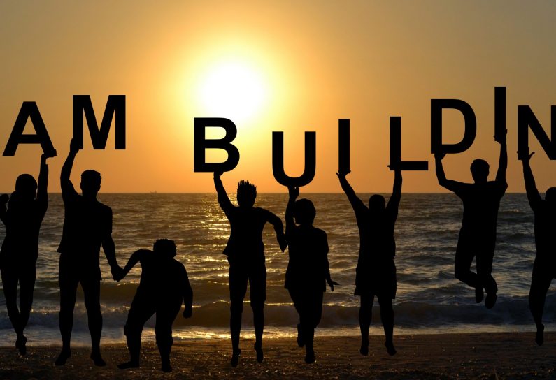 Team,Building,Concept,With,People,Entertaining,On,Beach